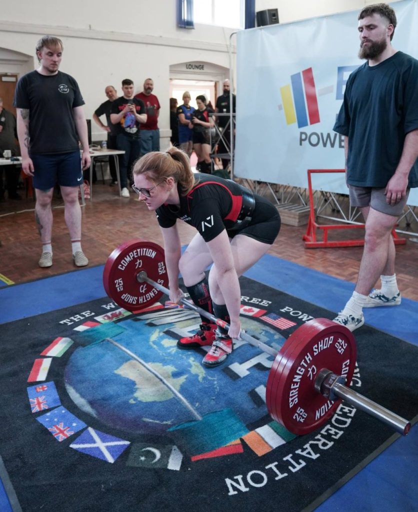 powerlifter preparing to deadlift 175kg at 65kg bodyweight, second place at national championships